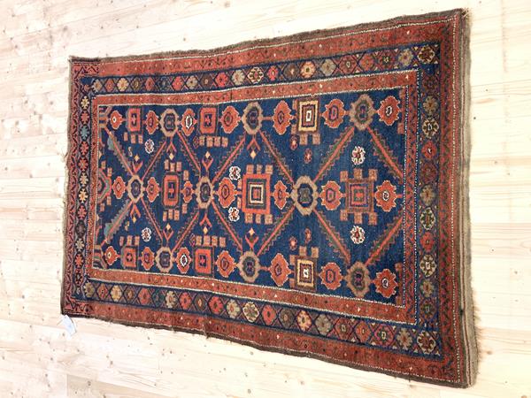 A Kazak rug, the sand coloured field with multiple geometric medallions, within multiple borders (172cm x 122cm), £60-90