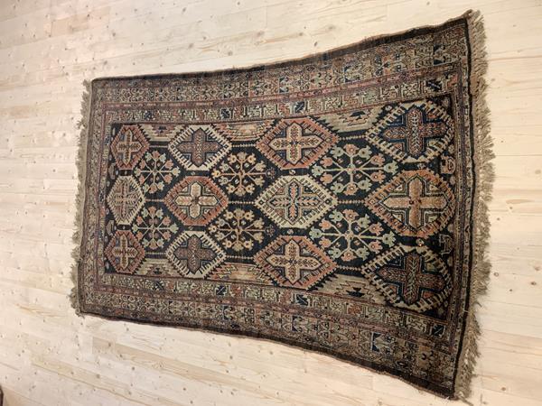 A Bokhara rug with four columns of repeating guls, within multiple borders (286cm 215cm), £120-180