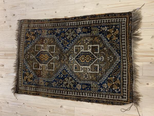 A Turkoman style rug, with tile pattern field and geometric design, within multiple borders (254cm x 186cm), £100-150
