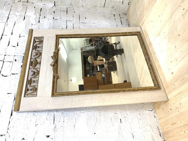 A gilt framed wall hanging mirror, the cavetto moulded frame enclosing a bevelled plate, 105cm x 75cm, £30-50